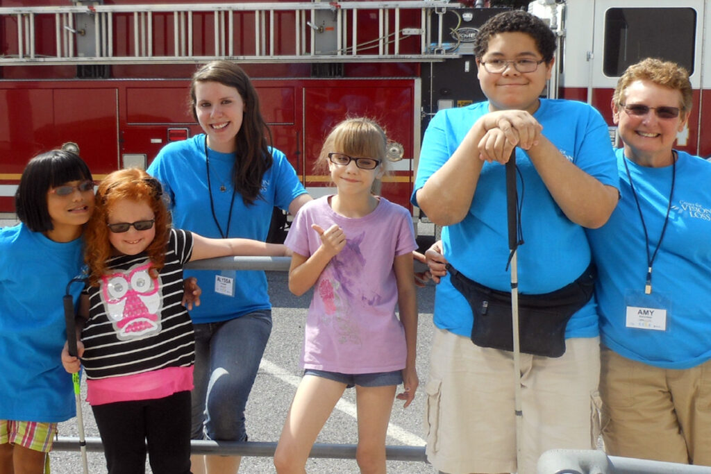Photo of Camp I CAN! kids and staff as they visit a firehouse