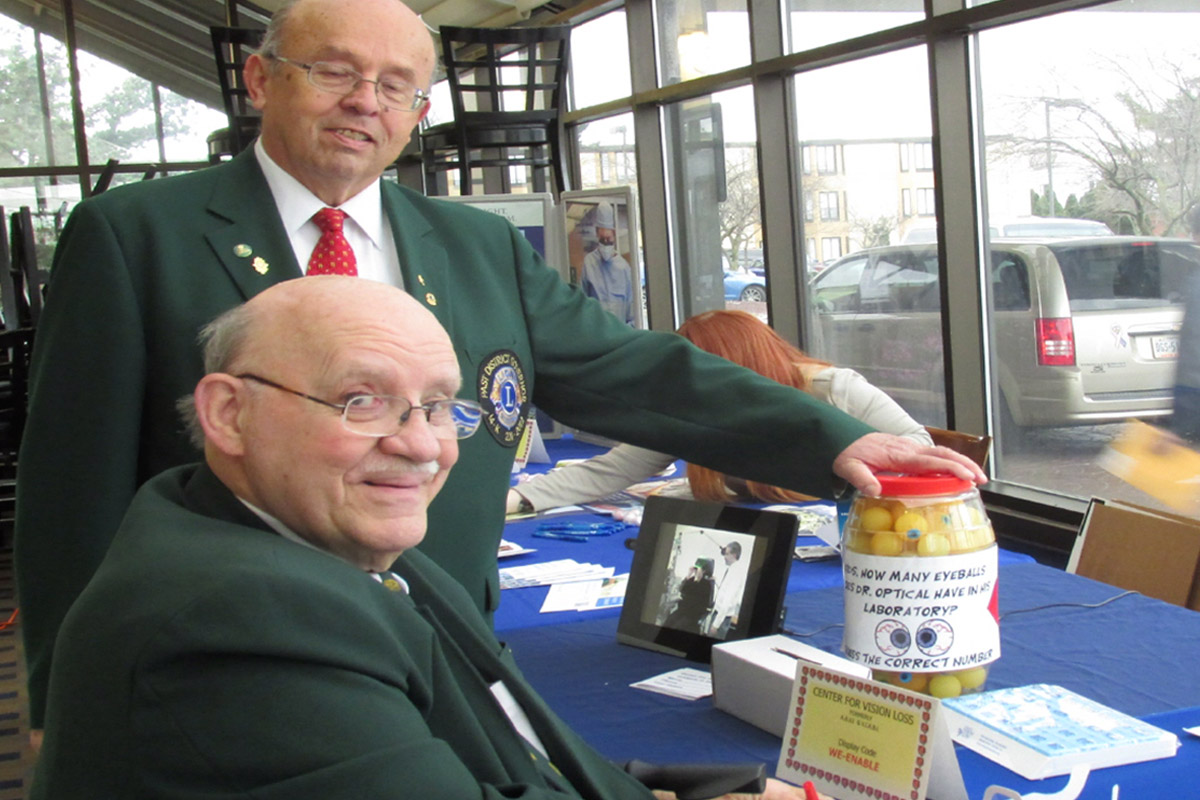 Photo of two Lions Club members in their formal jackets