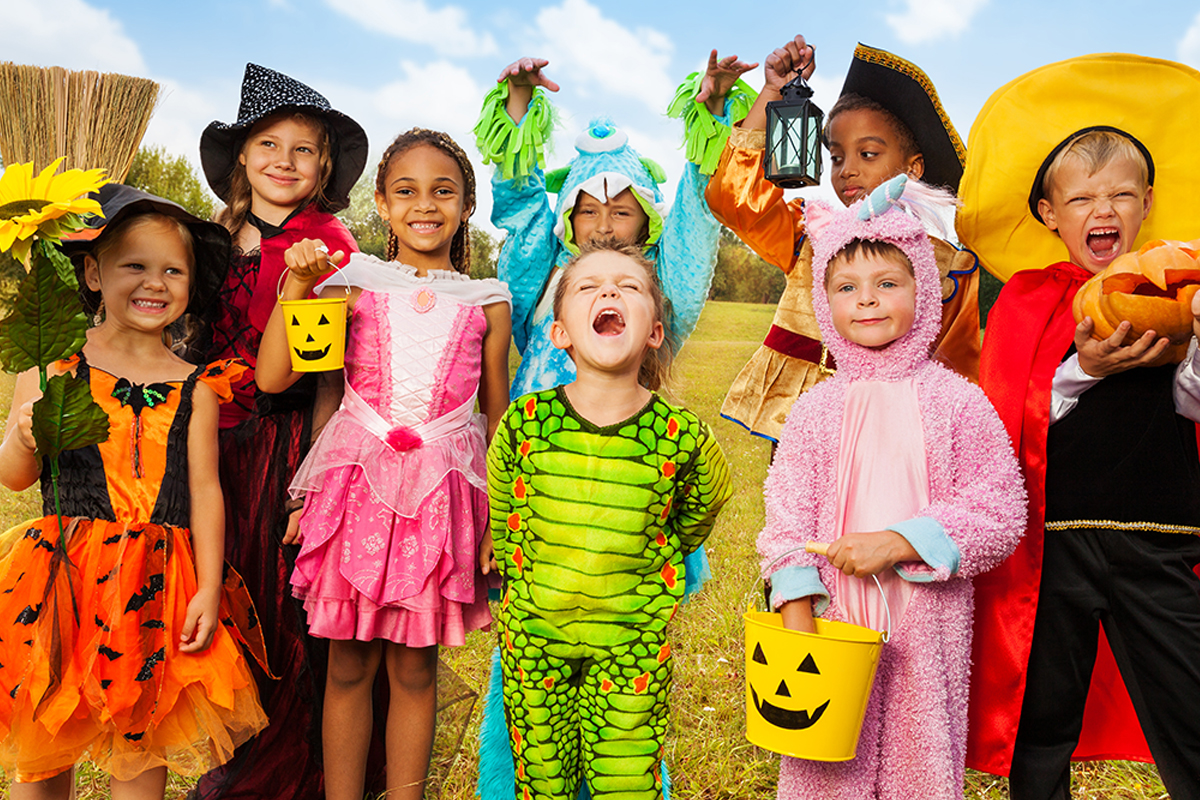 A group of children in different Halloween costumes