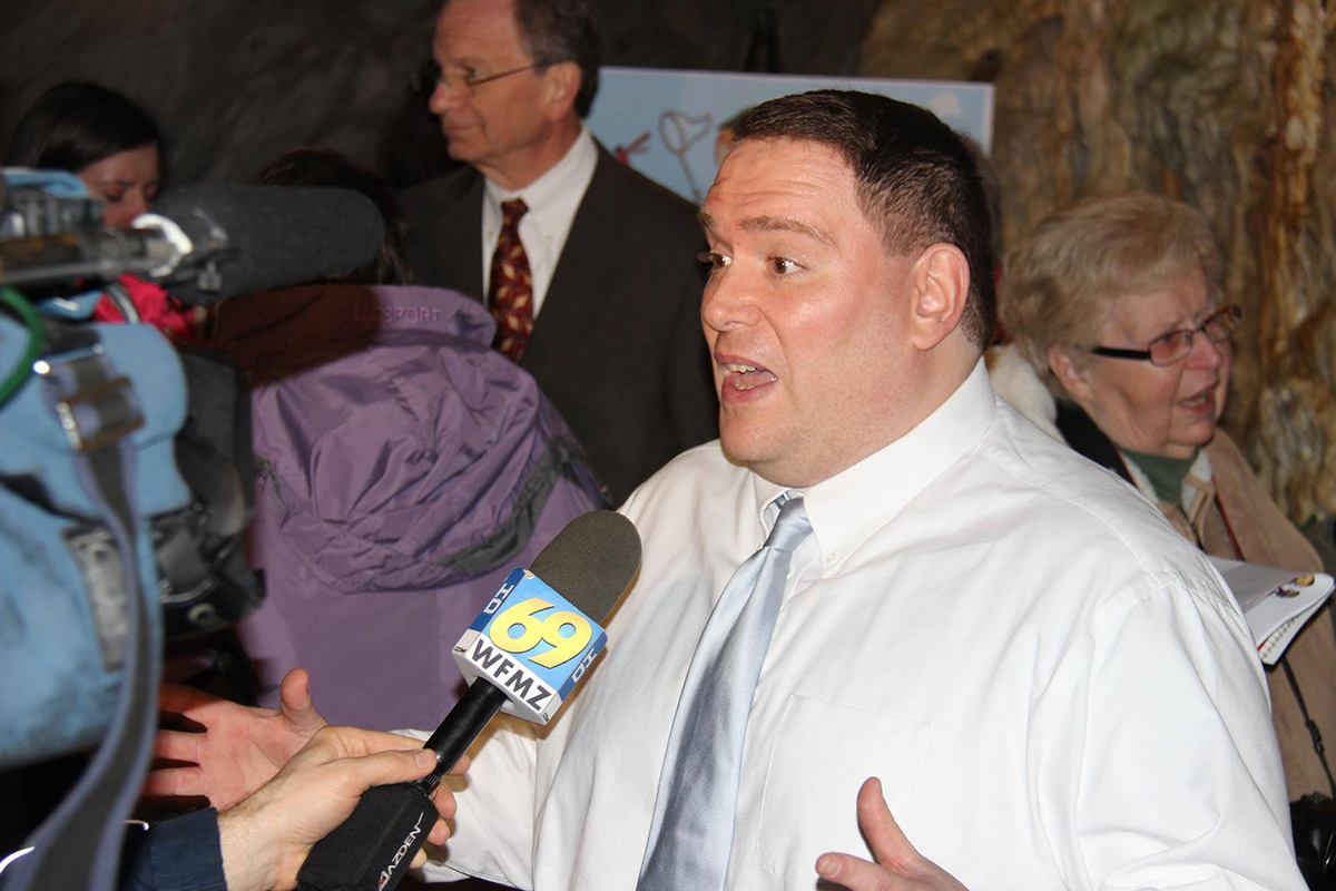 Dennis Zehner answering a question from a news media member