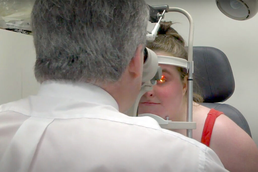 Picture of a client undergoing a low vision eye exam