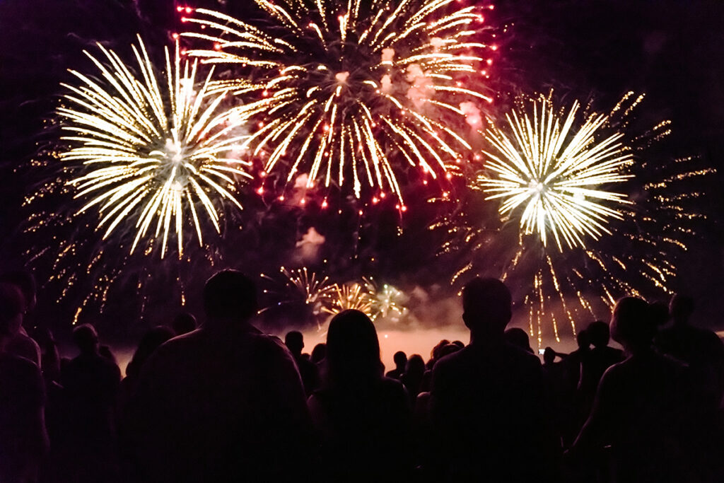 Image of a crowd watching a fireworks show