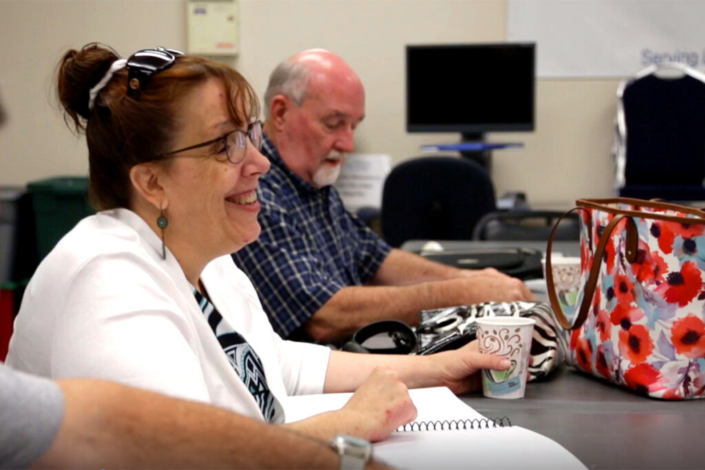 Agency clients in a braille class