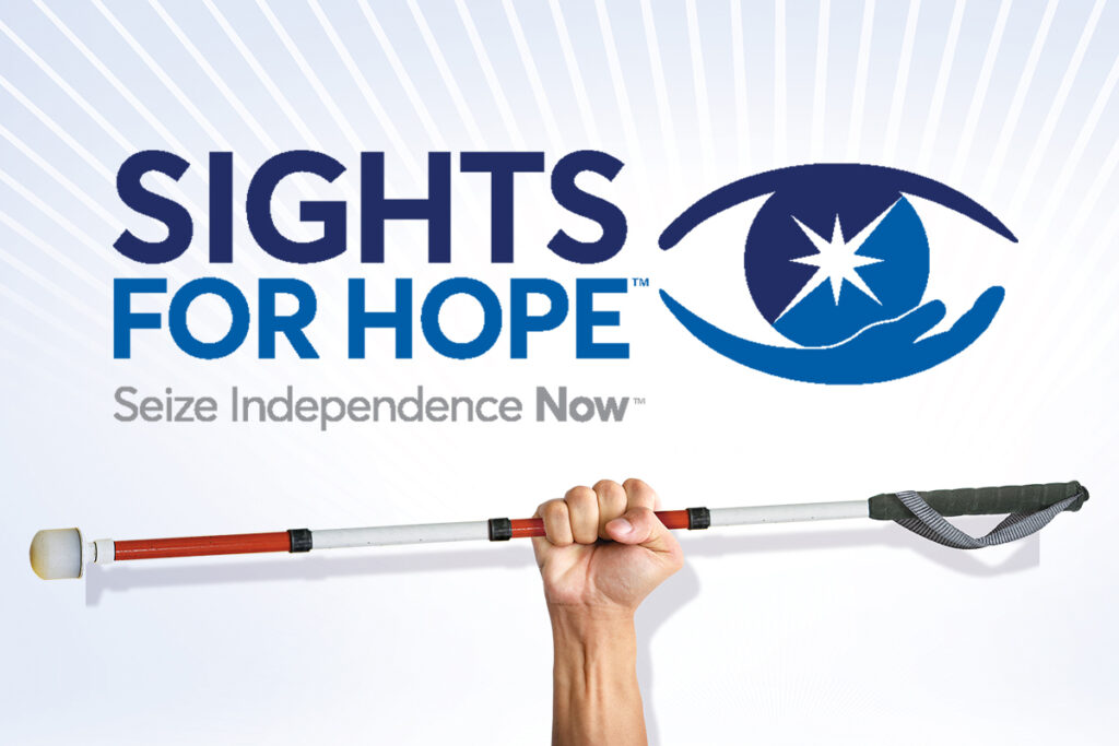 Sights for Hope billboard image of a person's hand holding a white cane with the agency logo above it.