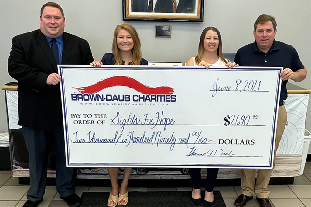 Photo of a check presentation from Brown-Daub Charities to Sights for Hope