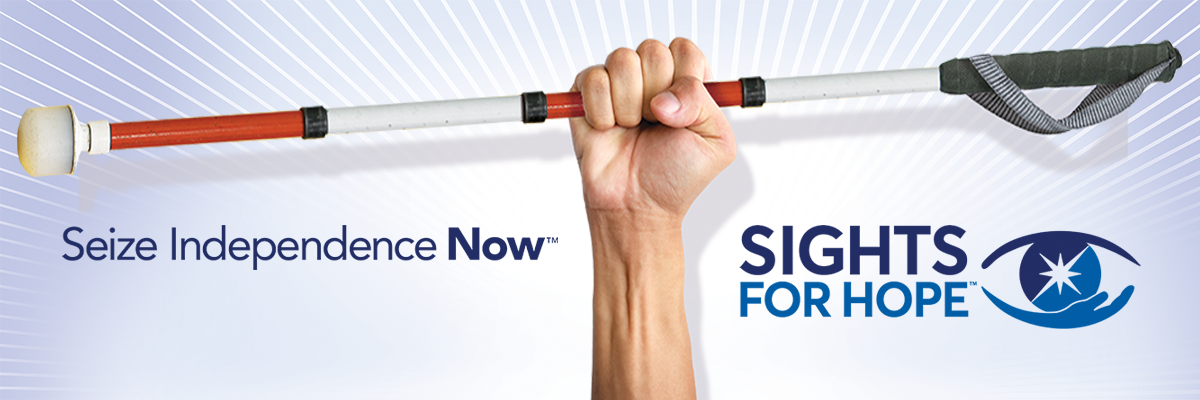 Photo of an arm holding a white cane in triumph against a blue and white backdrop along with Sights for Hope's logo and slogan "Seize Independence Now"