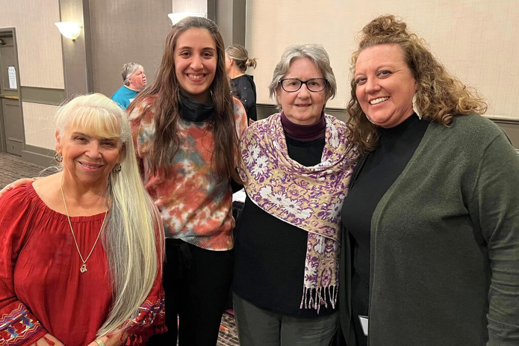 Photo of four women standing beside each other
