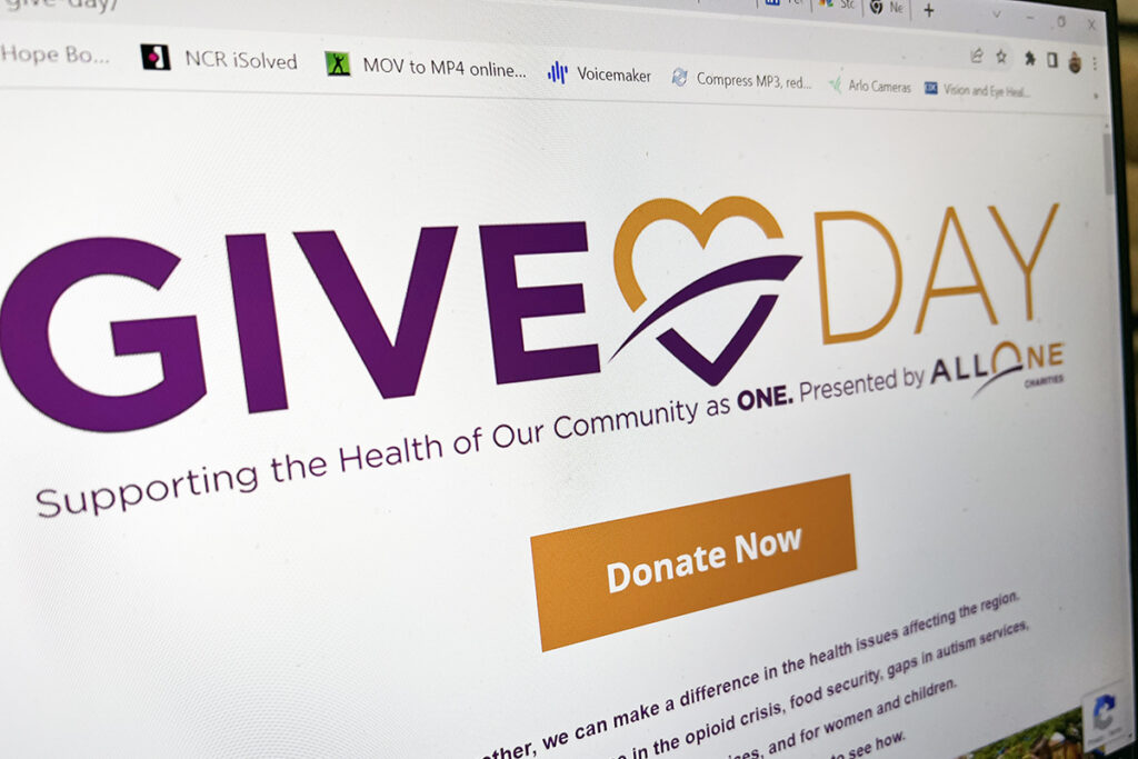 Photo of a computer screen showing the AllOne Charities Give Day website