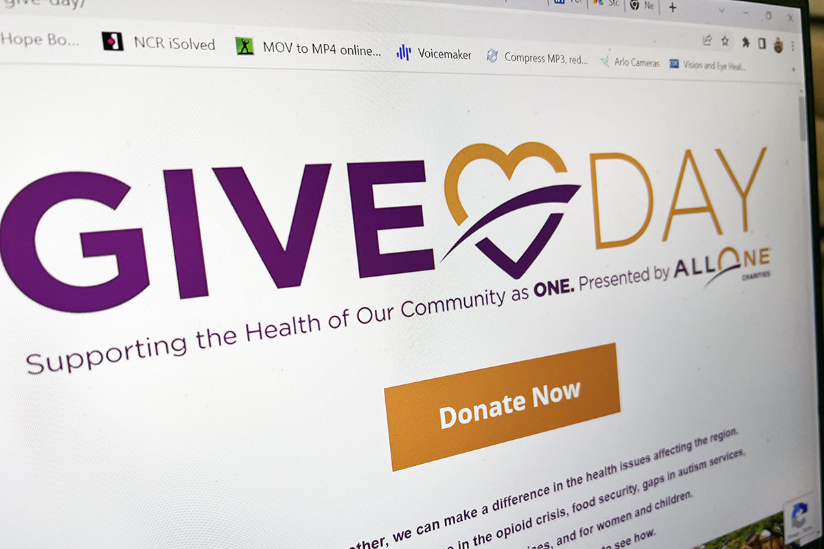 A computer screen showing the AllOne Charities Give Day website