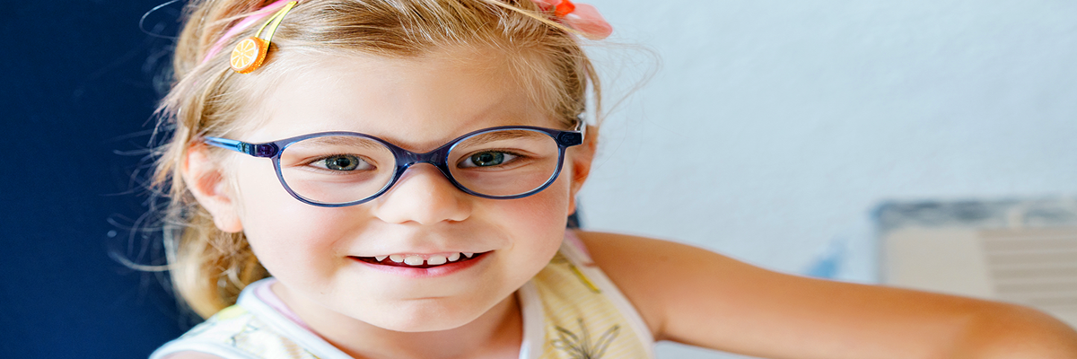 A pre-kindergarten girl wearing glasses