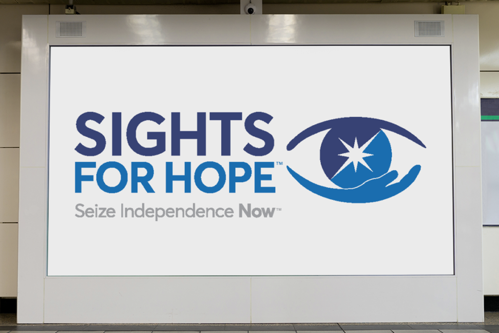 Photo of the Sights for Hope logo on a large white background on a wall