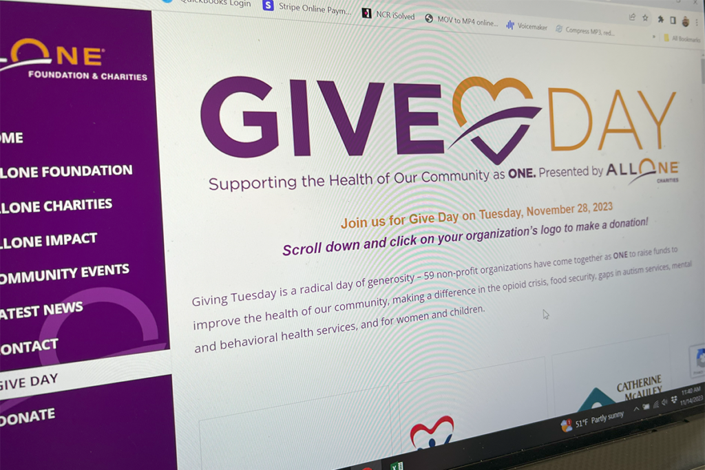 A computer screen showing the AllOne Charities 2023 Give Day website