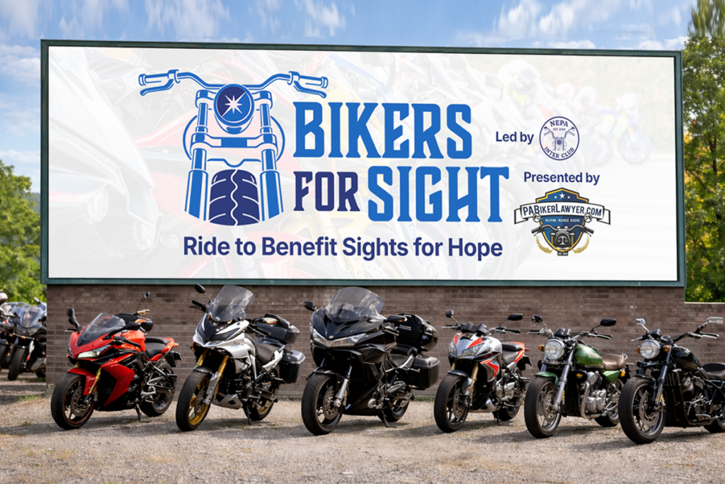 A line of motorcycles parked in front of a large sign reading "Bikers for Sight: Ride to Benefit Sights for Hope. Led by the Northeast PA Inter Club. Presented by PABikerLawyer.com"