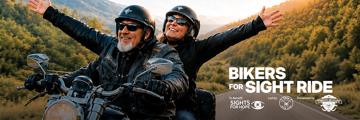 A promotional image shows two smiling motorcycle riders traveling along a scenic mountain road at sunset. The driver, wearing a black helmet and leather riding gear, focuses on the road while the passenger rides with both arms outstretched in celebration. Forested hills and distant mountains frame the winding roadway beneath a warm golden sky. On the right side, details read: Bikers for Sight Ride, benefiting Sights for Hope, led by the NEPA Inter Club, presented by PABikerLawyer.com.